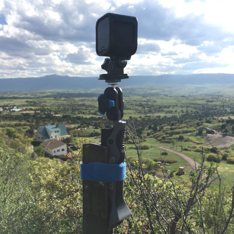 Pedco UltraPod GO strapped to fence post with GoPro.